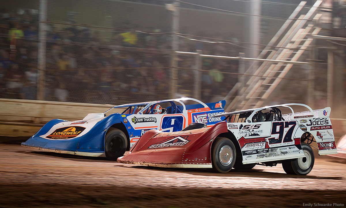 Cade Dillard (97) battles with Nick Hoffman (9) in World of Outlaws CASE Late Model competition